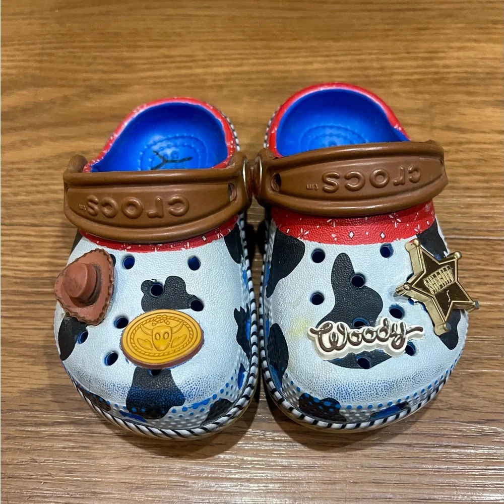 CROCS Kids Woody Cow Print Clogs in White, Black & Brown